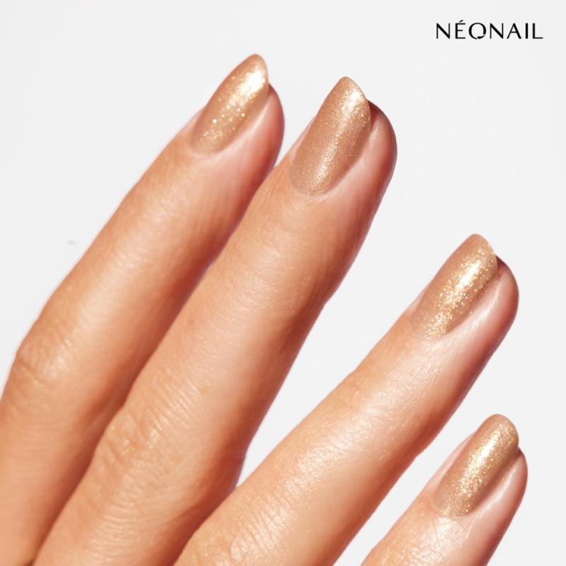 Brązowy lakier klasyczny z lśniącymi, złotymi drobinami: Sunkissed Glow Bronze &ndash; paznokcie jak muśnięte słońcem